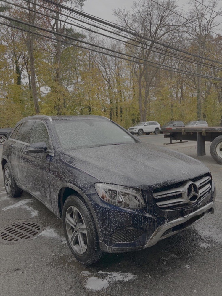 Professional hand wash in progress at Professional Car Detailing in Locust Valley, NY